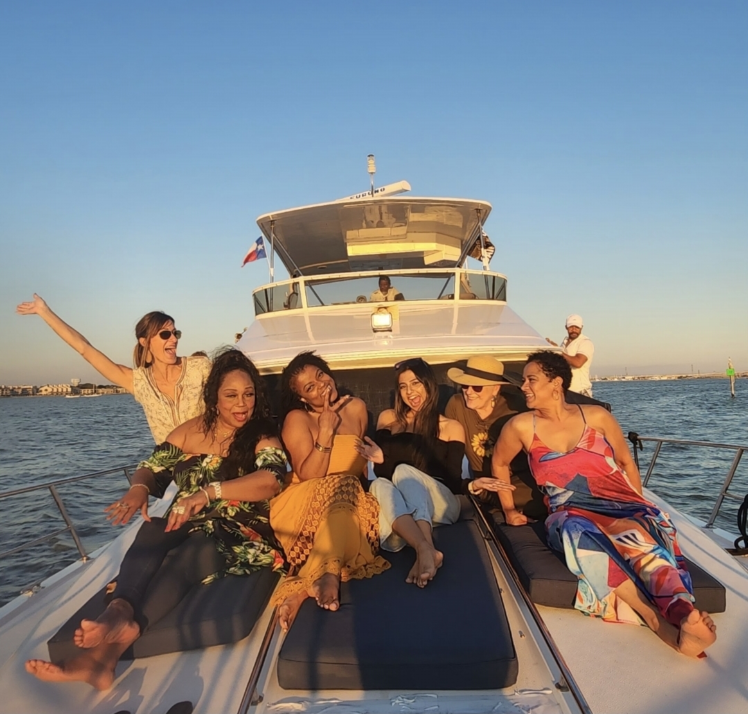 Guests relaxing on the bow at sunset
